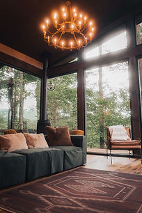 At Hidden Lake Treehouses in Cherry Log, GA, you can elevate your perspective in a unique way. These award-winning vacation homes, designed by architect James Knight of Reynard Custom Homes, are not your typical retreat. Winner of the Atlanta Home Magazine Georgia Design Awards for Best Residential New Build (up to 4,000 sq ft), these modern rustic treehouse-style homes immerse you in the North Georgia mountains. With their stunning floor-to-ceiling windows, outdoor firepits, and ample space for the kids, these homes offer a truly unique experience.
