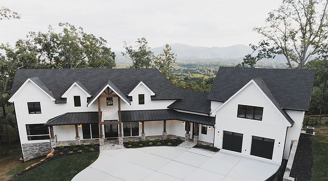 exterior view of a single family custom home designed by Reynard Custom Homes in Winding Ridge Highland Park Blairsville, GA. designed by architect James Knight 