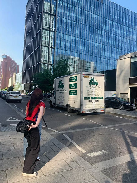 Moving truck in Finchley street with office building