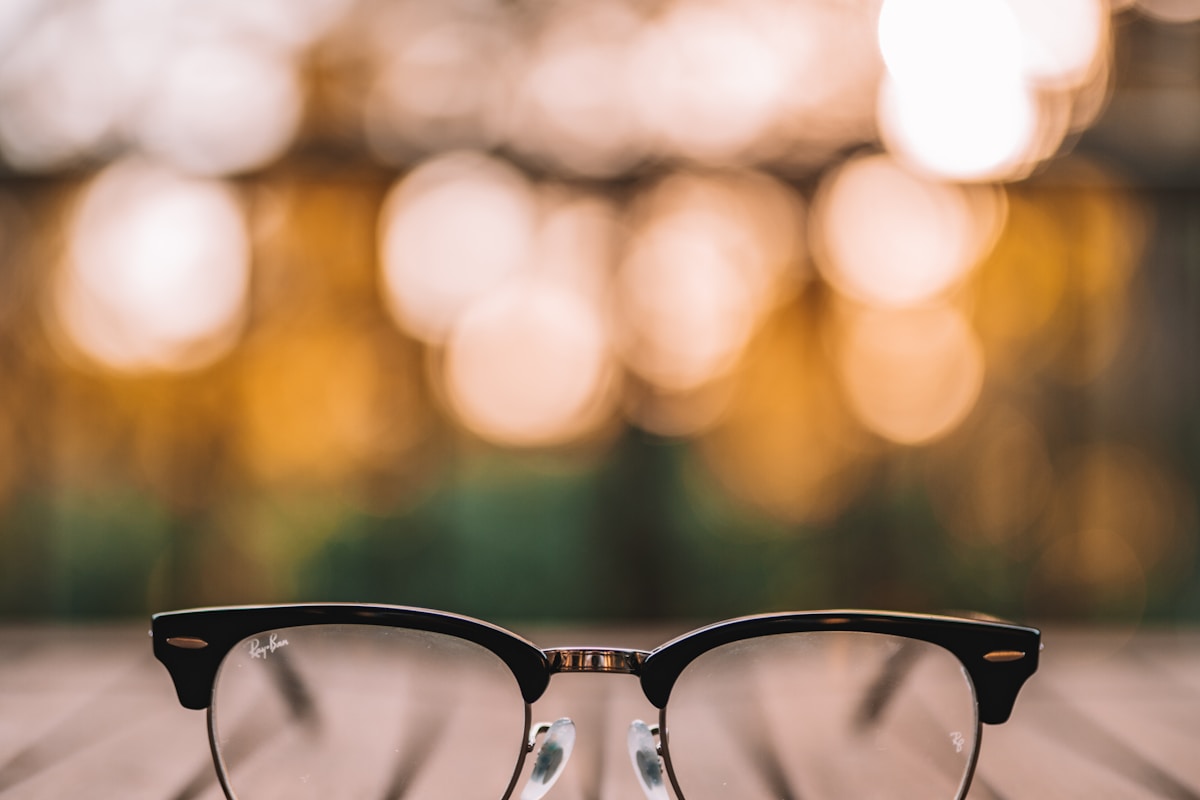 Close-up of hinge mechanism showing durability testing apparatus and measurement instruments