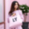 so the theme is lilac pink and white...create a girl holding a bag with LY on it...real gi