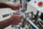 plant-worker-turning-levers-on-pipe-2023-11-27-04-56-24-utc.jpg
