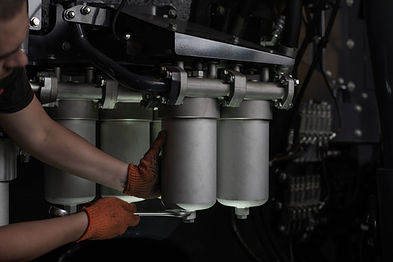 Low key photo of hydraulic pipes mainten