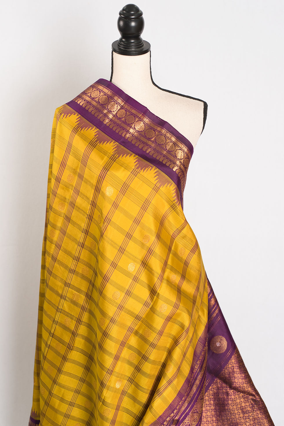 Thumbnail: Nandini yellow and purple checks handwoven Gadwal silk saree with a golden zari border.