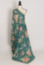 Full-length view of the Afrin teal floral Chinon crepe saree on a mannequin, showcasing the soft drape and pearl border.