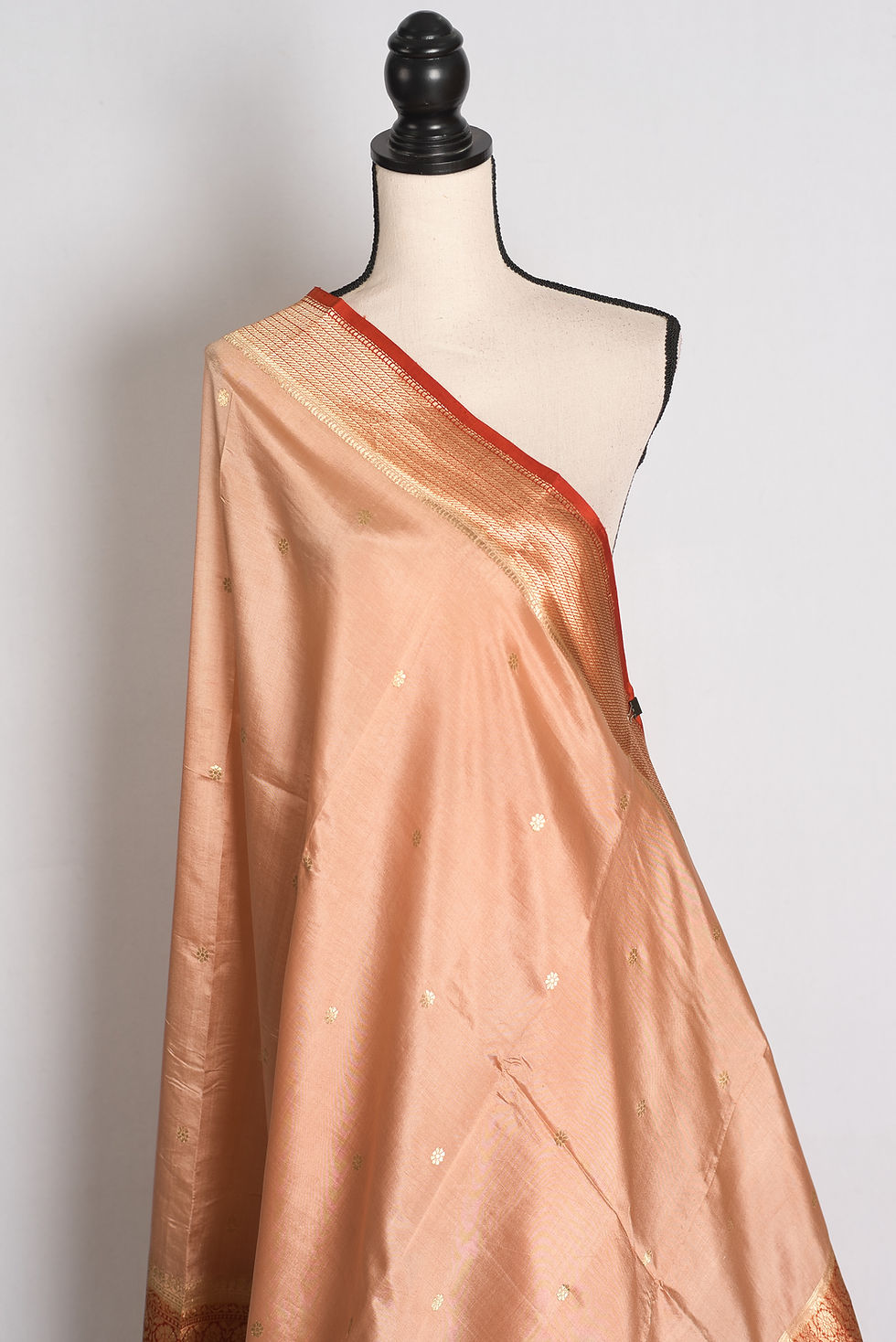 Thumbnail: Sandalwood Brown and Rust Wide Border Mango Silk Banarasi Saree draped elegantly on a mannequin.