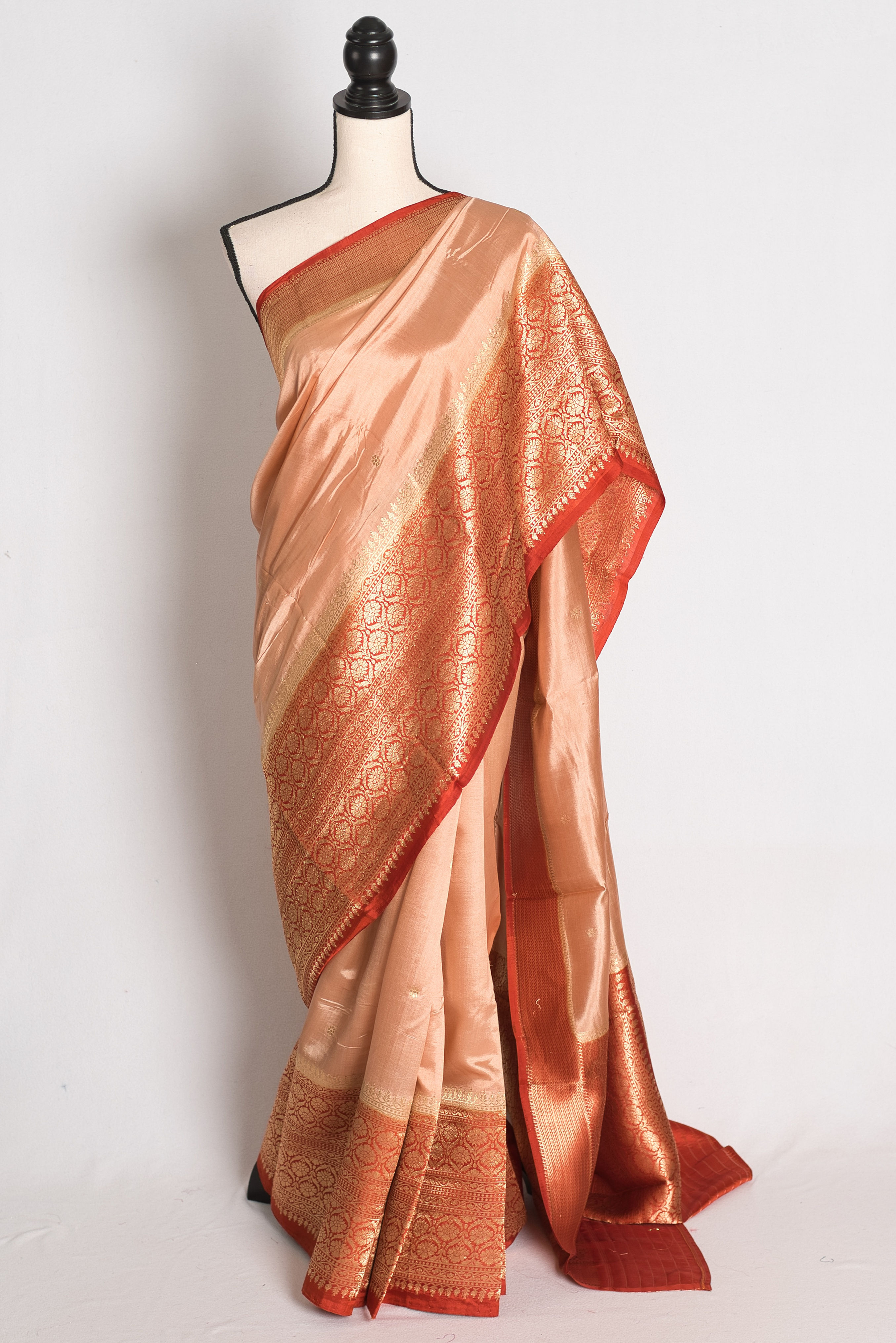 Sandalwood Brown and Rust Wide Border Mango Silk Banarasi Saree draped elegantly on a mannequin.