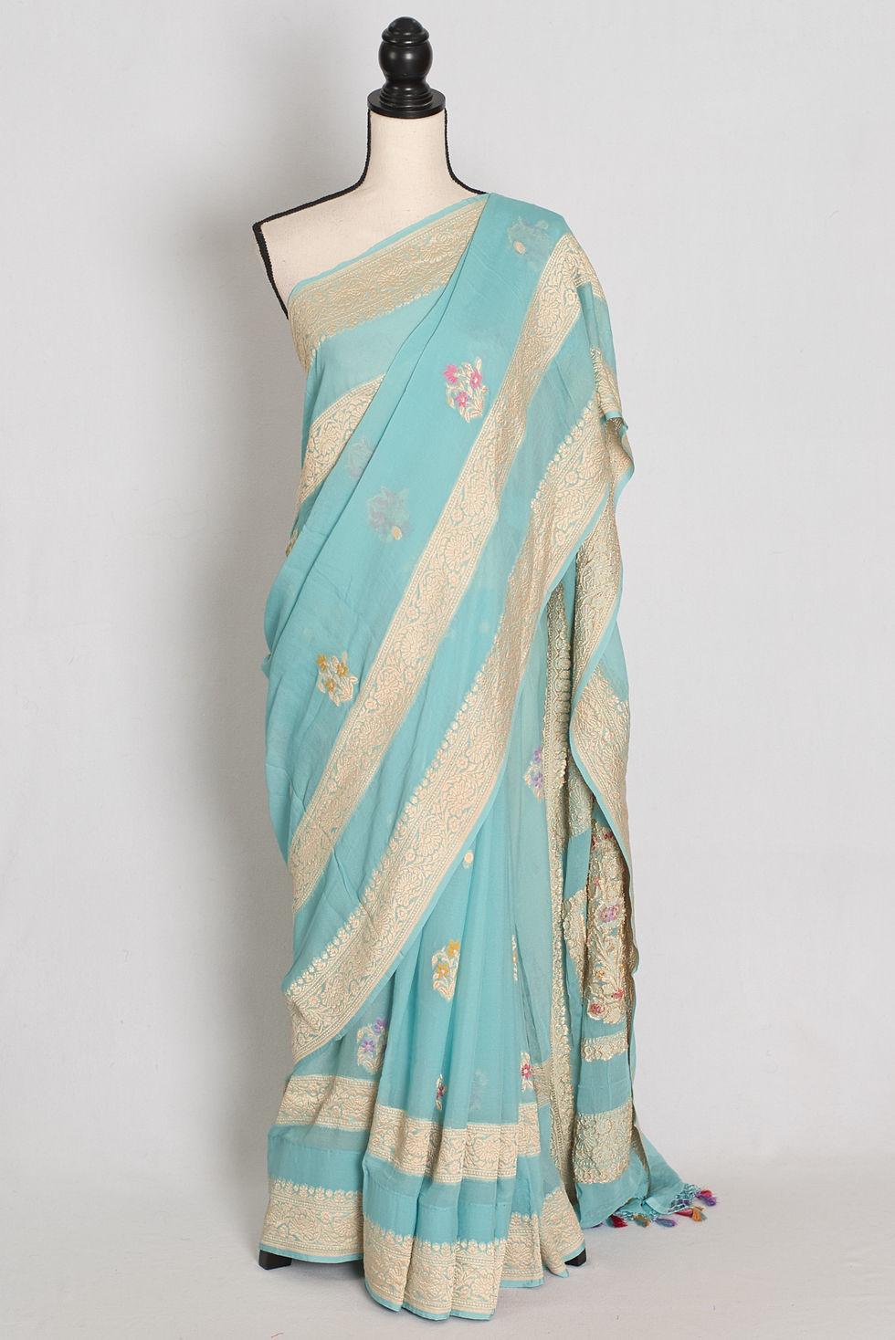 Sky blue handwoven pure Khaddi georgette silk Banarasi saree with gold zari meenakari bootis, ornate pallu, and tassels.