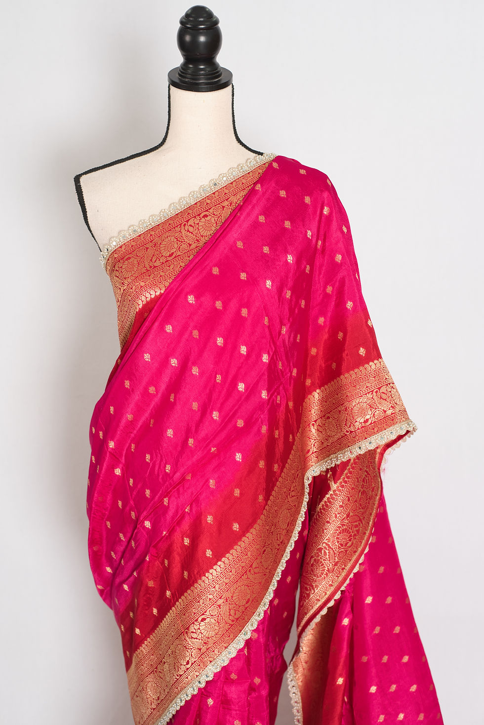 Thumbnail: Front view of the pink and red Dola silk Banarasi saree draped on a mannequin.
