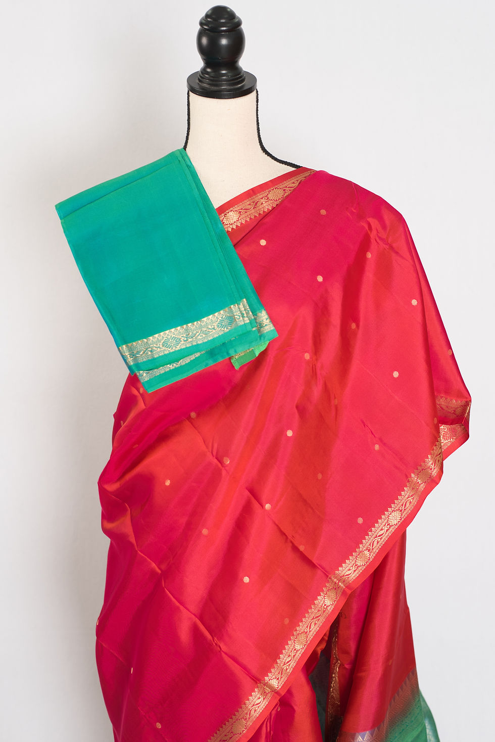 Thumbnail: Roopa peachy orange Kanjivaram silk saree with small gold border and gold polka dot motifs.