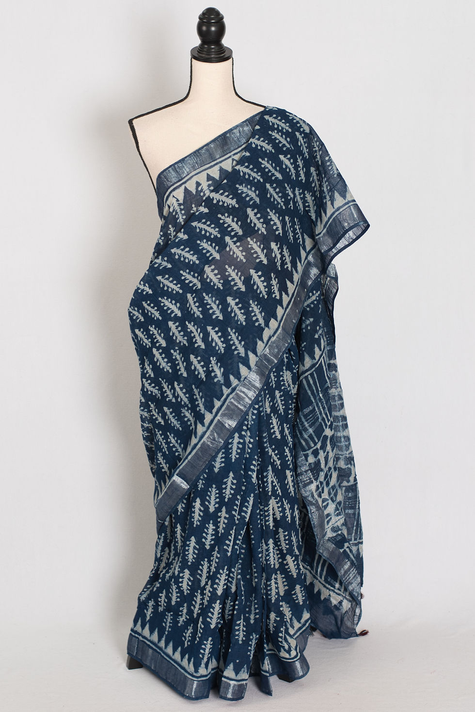 Gracy indigo blue linen cotton saree with traditional Kalamkari floral motifs and a contemporary matte finish.