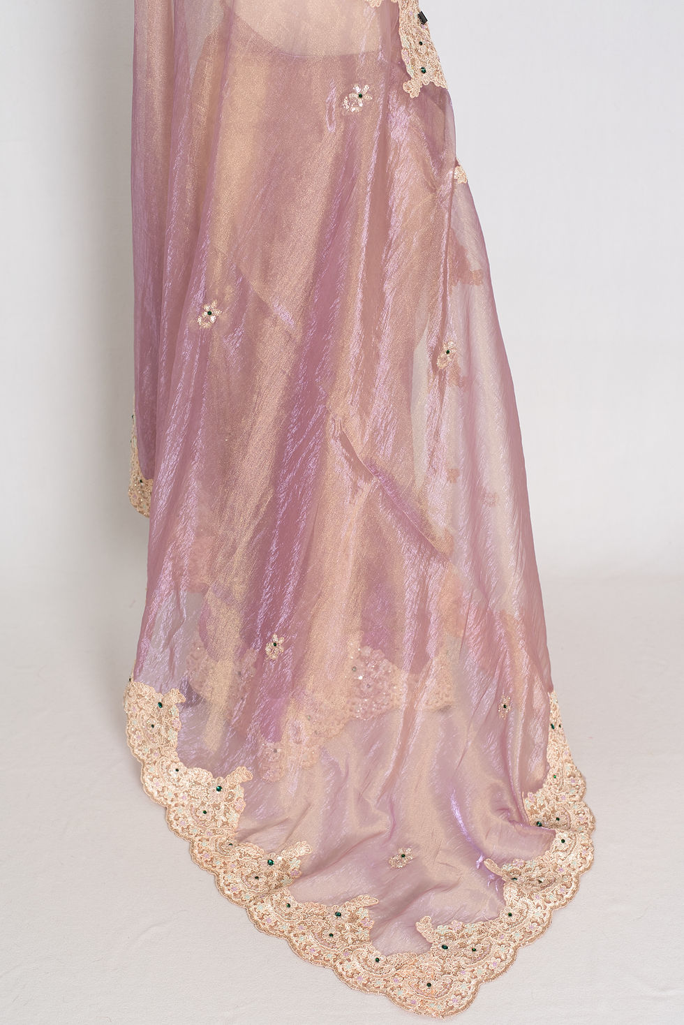 Thumbnail: Front full-length view of the lavender soft tissue partywear saree draped on a mannequin.