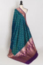 Silk Mark certified peacock green pure Banarasi silk saree featuring a rich contrast purple border with traditional gold zari