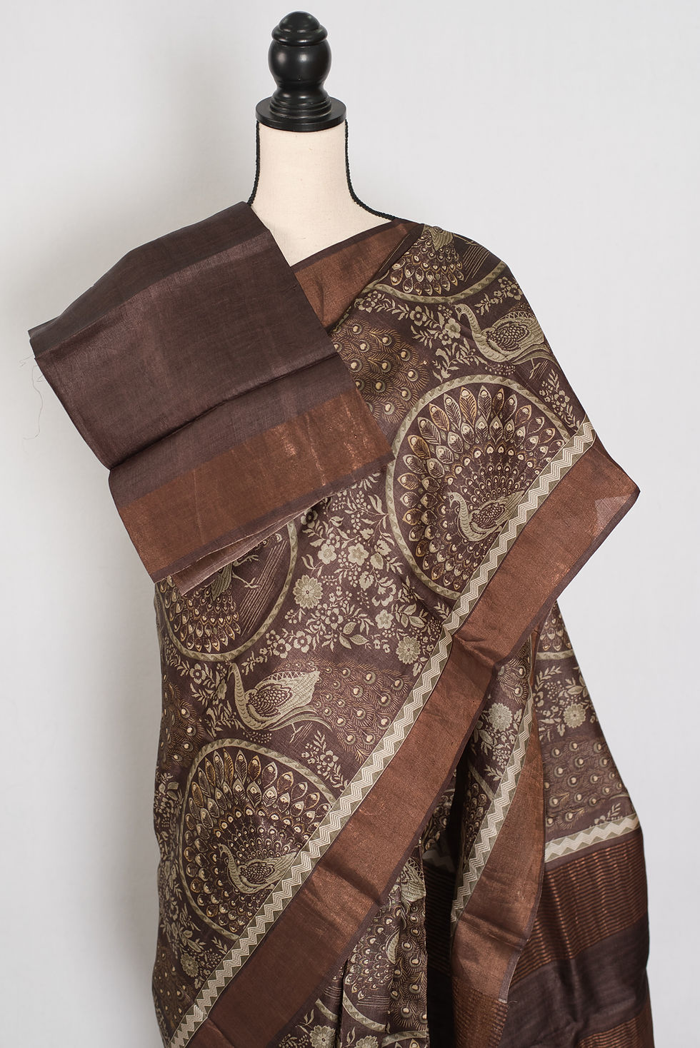 Thumbnail: Silk Mark certified earthy brown pure Tussar silk saree featuring traditional intricate Kalamkari art prints.