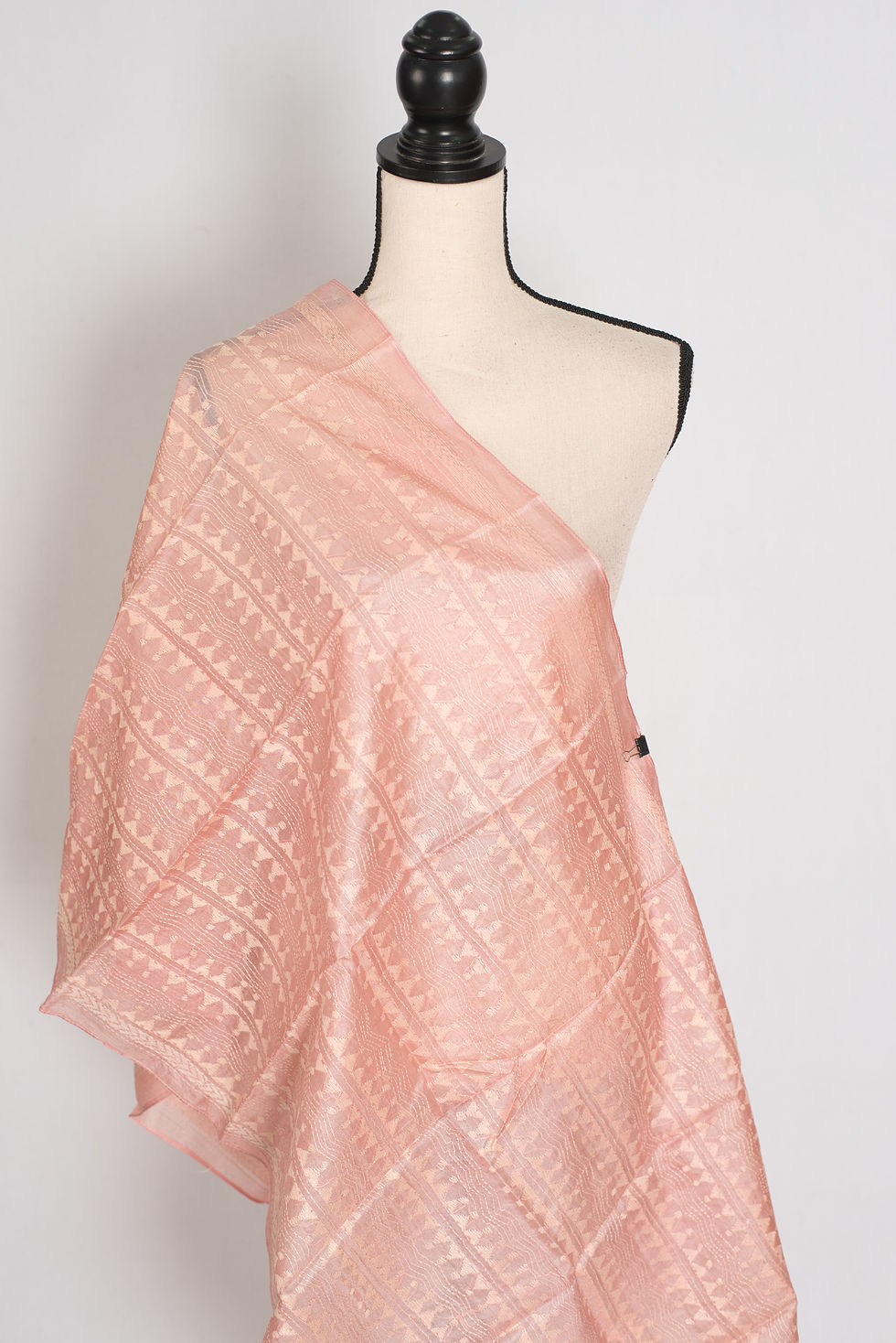 A Silk Mark Certified pure Tussar silk stole named Benu in a soft pastel peach color, draped elegantly on a mannequin.