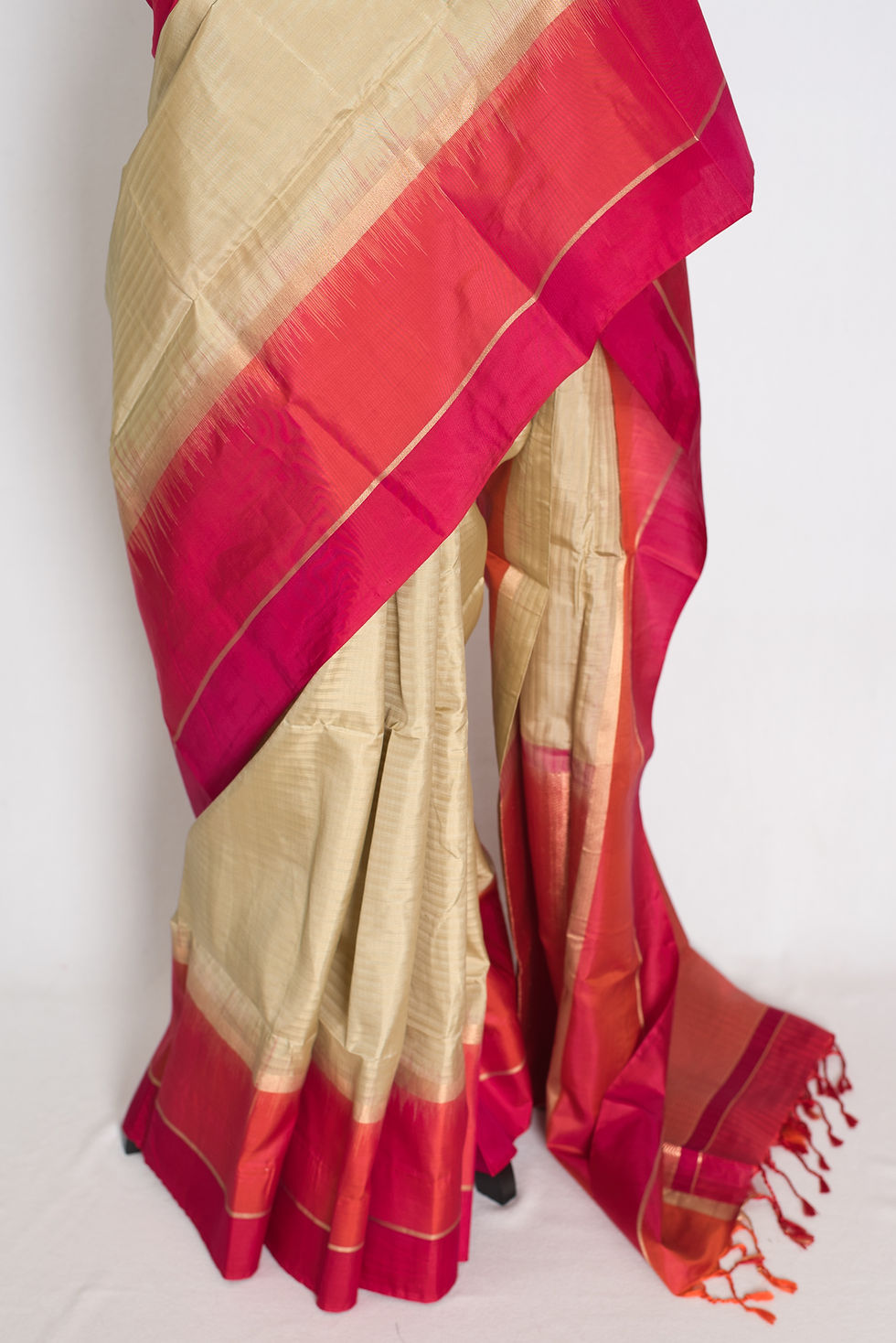 Thumbnail: Clay brown lightweight Kanjivaram silk saree featuring a wide orange and red border, gold zari pinstripes, brocade pallu.