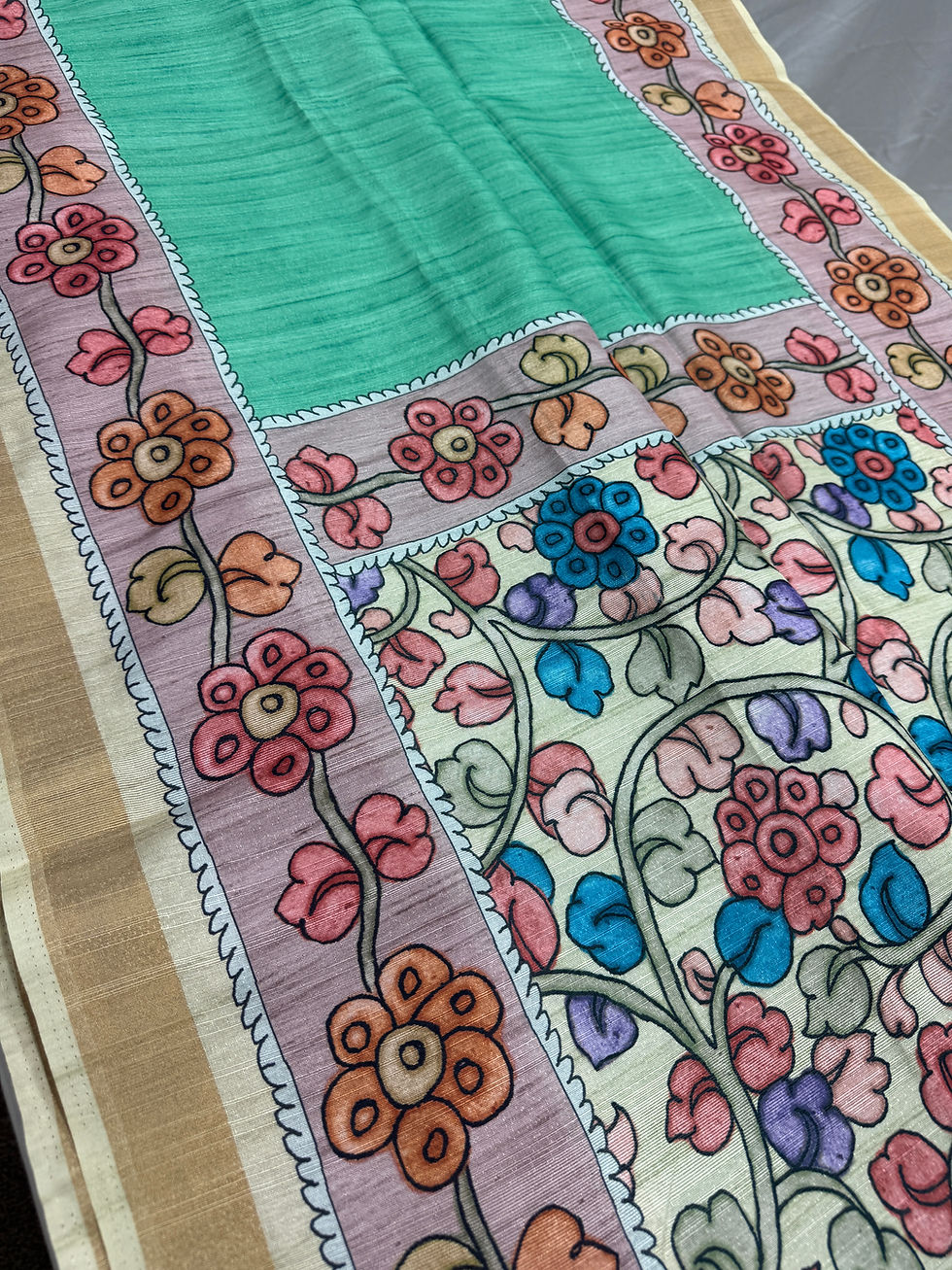 Lia collection Sea Green and Off-White Semi Tussar Saree with colorful floral Kalamkari print.