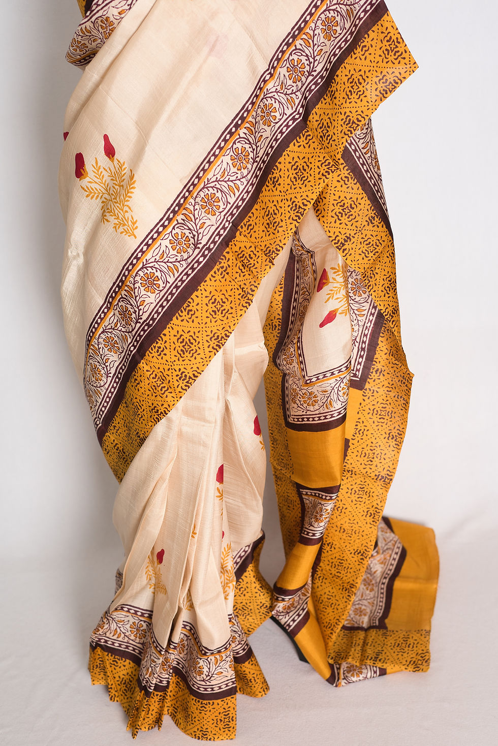 Thumbnail: Full-length view of the cream and mustard yellow hand block printed 3-ply Murshidabad pure silk saree on a mannequin.