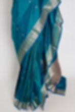 Thumbnail: Peacock green pure katan silk Banarasi saree with gold zari floral motifs and Silk Mark certification.