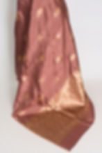 Thumbnail: SIA: Chocolate brown Katan Banarasi silk saree with gold zari floral buttas and intricate border on a mannequin.