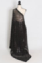 Black soft net fitted cocktail saree on a mannequin showing its translucent body-hugging drape.