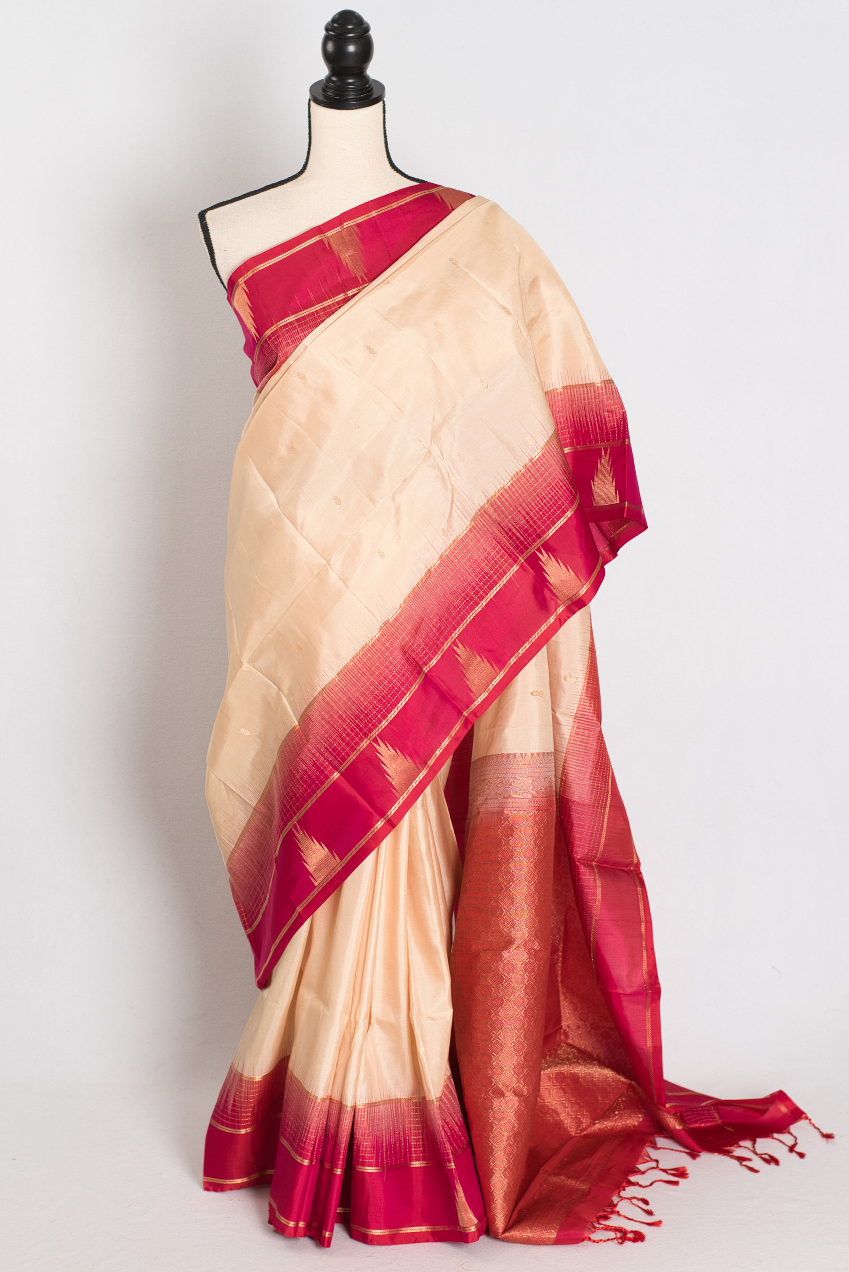 Clay white and Rani pink Kanjivaram silk saree with a gold border (Naina Collection).