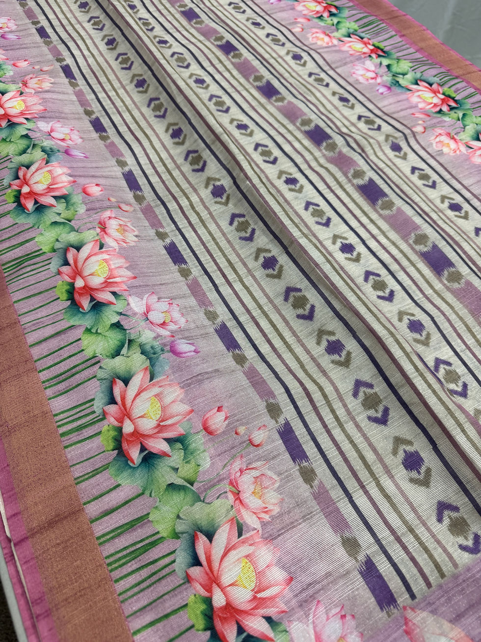 Thumbnail: Off white and lavender semi tussar saree featuring lotus prints and ikkat patterns, with matching lavender blouse.