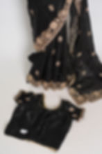 Front full-length view of the black tissue zardosi embroidery saree displayed on a mannequin with stitched blouse.