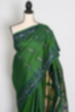 Thumbnail: Front full-length view of the forest green handwoven Baluchari pure silk saree on a mannequin.