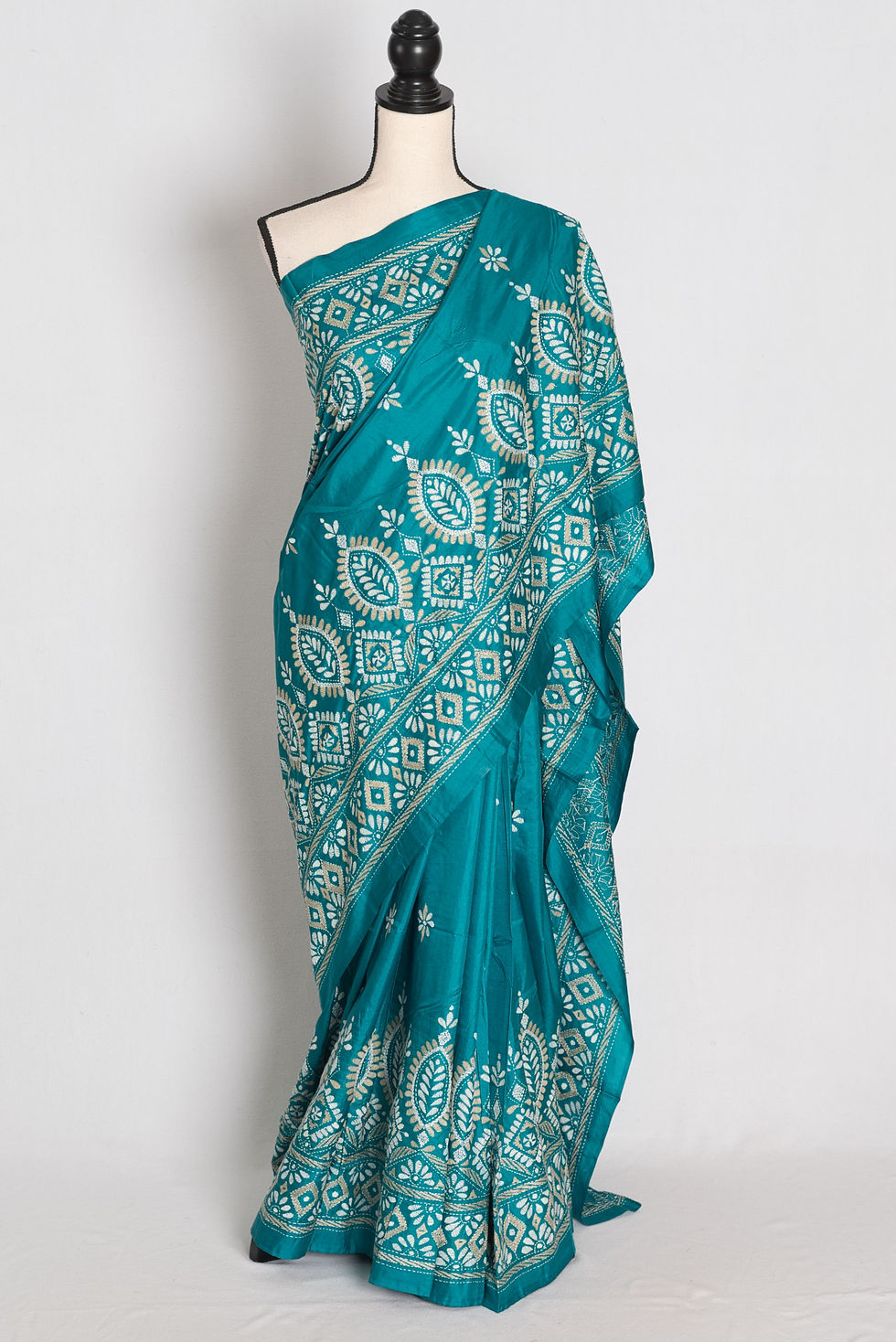 Blue green pure silk saree featuring intricate beige and white hand-embroidered Kantha stitch floral and geometric motifs.