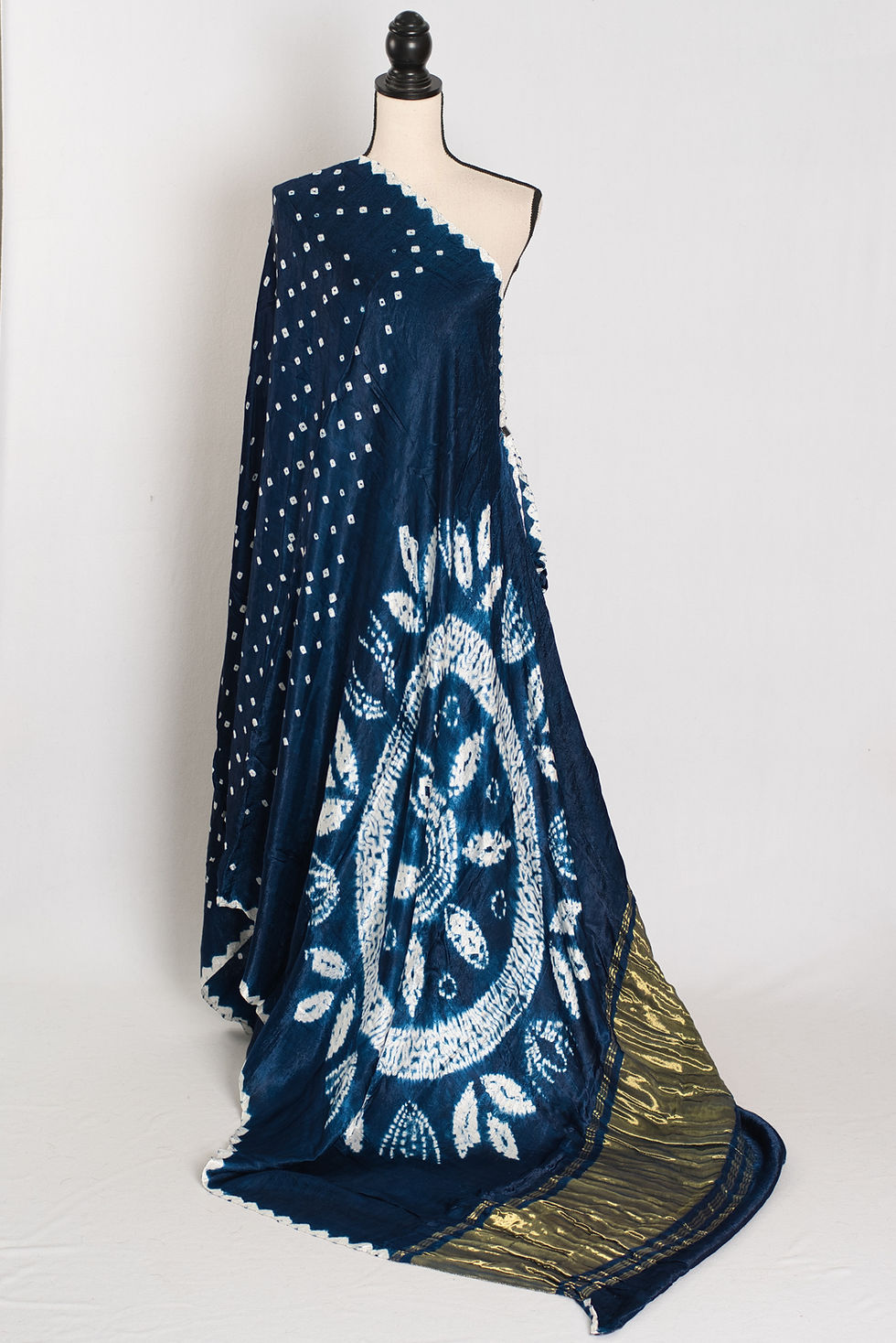 Saira navy blue and white hand Bandhani modal silk designer saree with traditional tie-dye patterns.