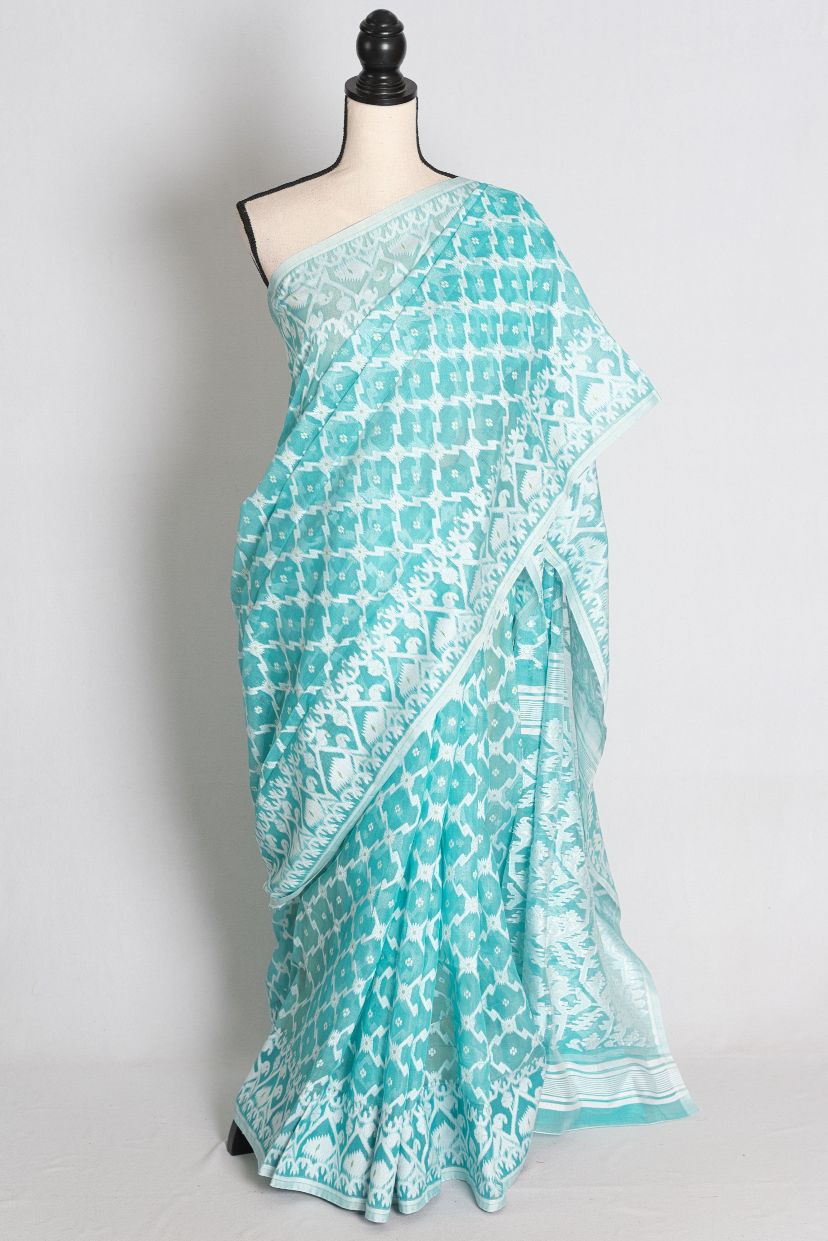 Turquoise Blue and White Soft Cotton Jamdani Saree draped on mannequin.