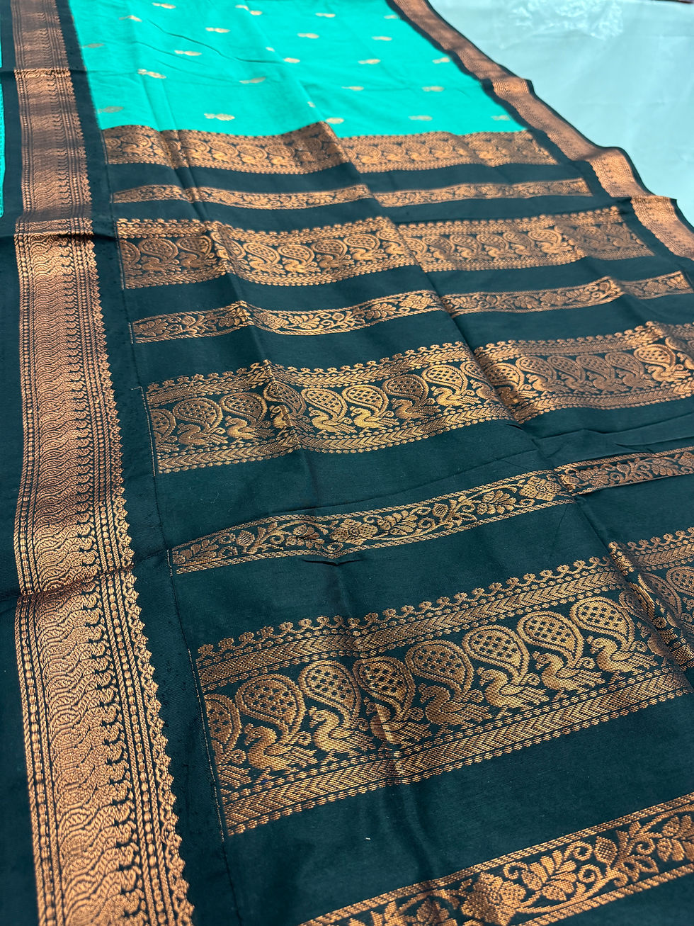 Sea green blended cotton Gadwal saree with black and copper zari border featuring paisley motifs.