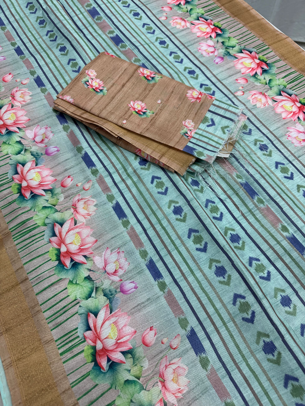 Thumbnail: Soma collection: Sea green ikkat print semi tussar saree with pink lotus motifs and brown border, shipped from New Jersey.