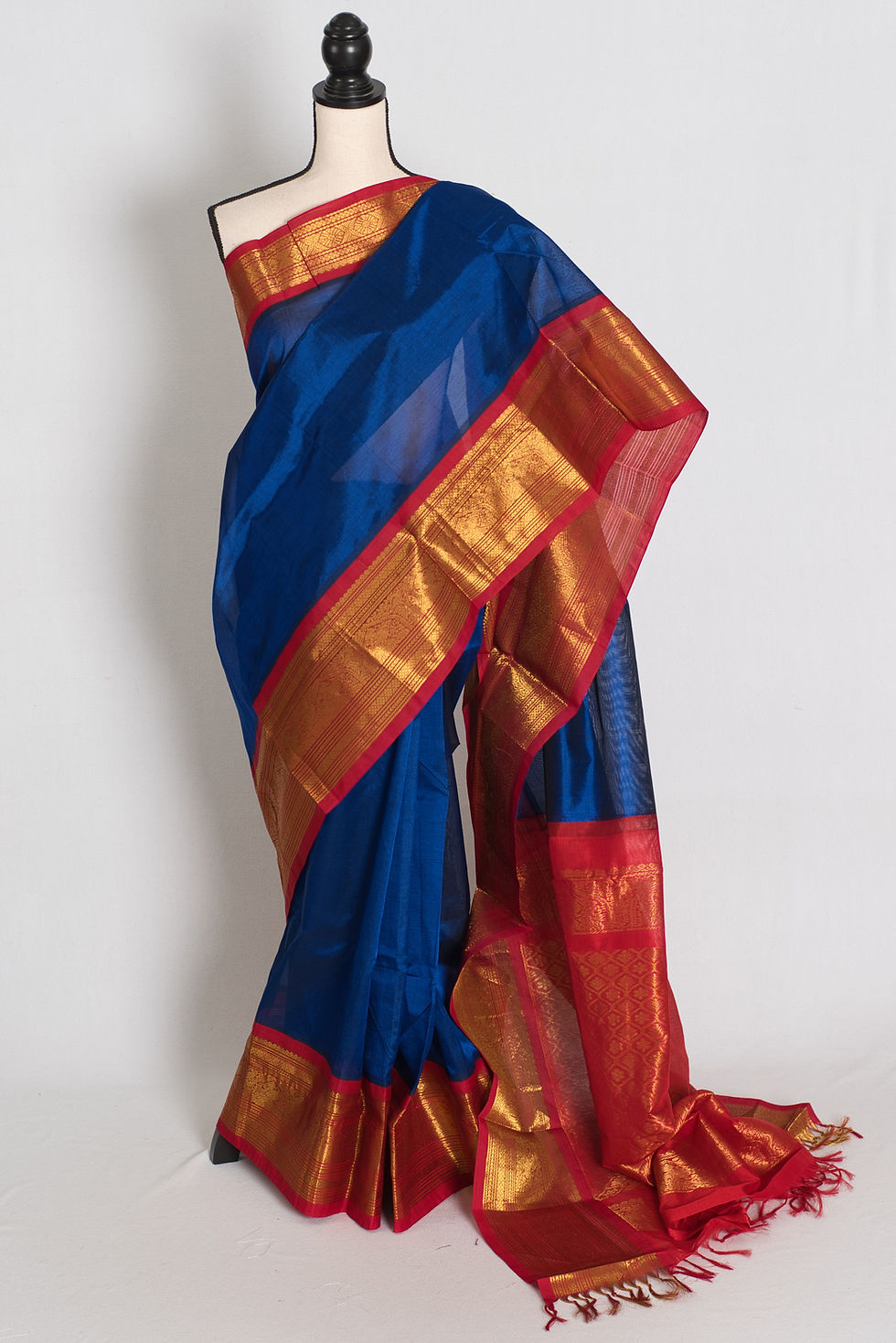 royal blue and red cotton silk kanjivaram saree draped on a mannequin showcasing the full length front view.