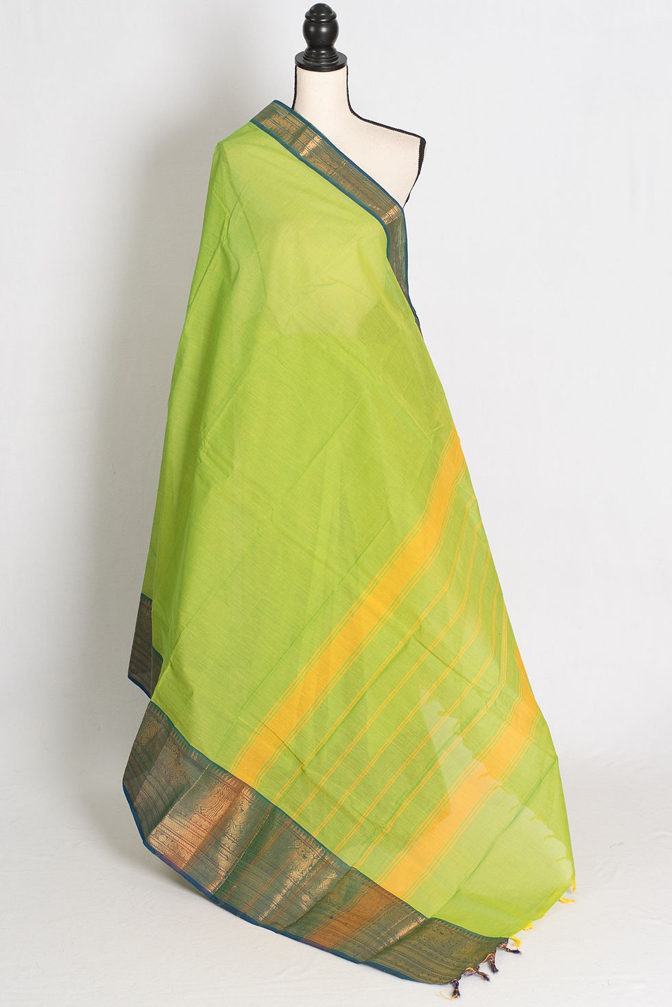 Nalini Collection: Bright green and blue handwoven Kanchi cotton saree with traditional border on a mannequin.