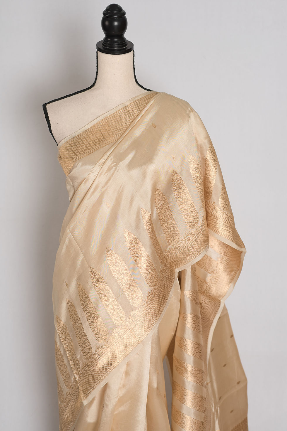 Thumbnail: Cream and gold zari handwoven satin Katan pure silk Banarasi saree with pastel mint green contrast blouse piece.
