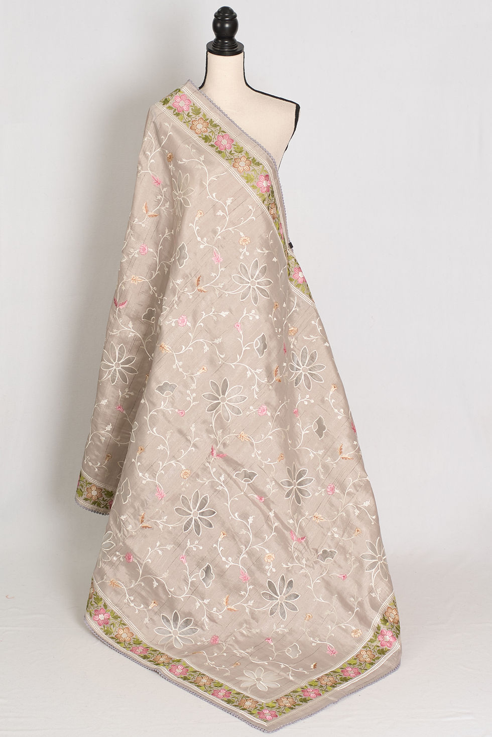 Sriti Dove Grey semi Tussar silk saree with colorful floral cut work embroidery displayed on a mannequin.