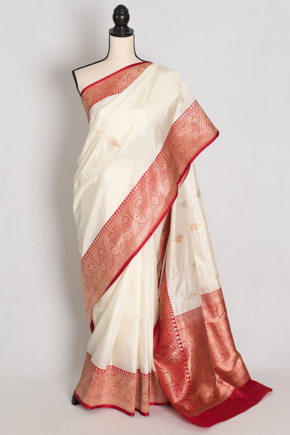 Off-white and red handwoven pure silk Banarasi saree with silver zari bootis, rich red zari border, and matching blouse piece