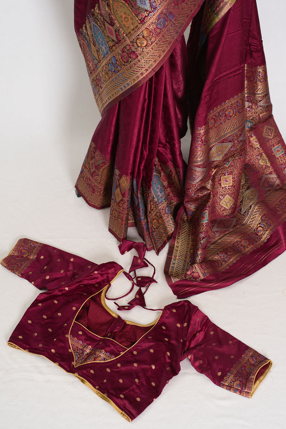 Madhabi magenta semi mashru Banarasi silk saree with gold zari work and matching size 36 stitched blouse.