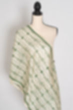 A Silk Mark Certified pure Tussar silk stole in natural beige draped elegantly over a mannequin.