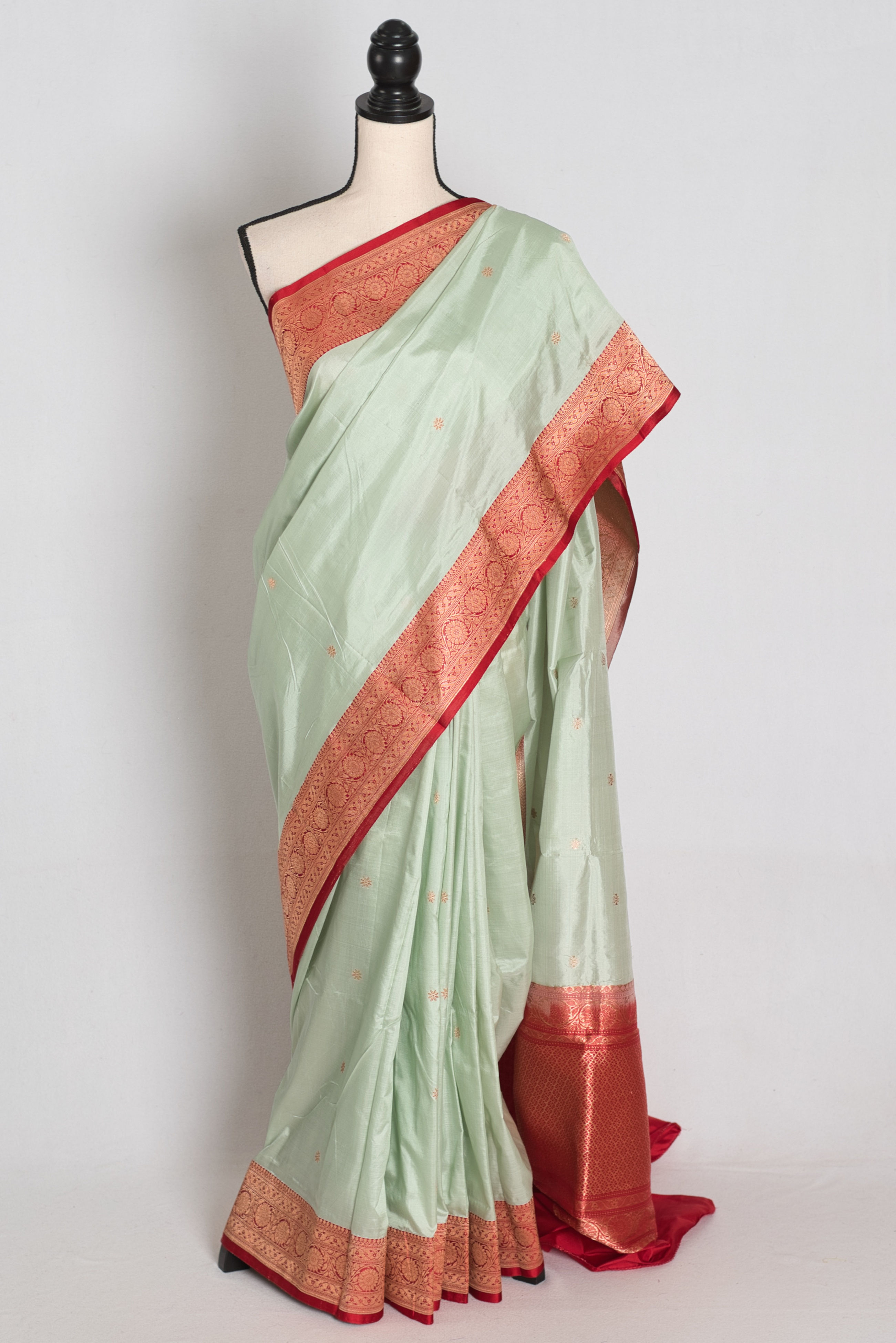 Pastel Green and Red Pure Silk Handloom Banarasi Saree draped on mannequin.