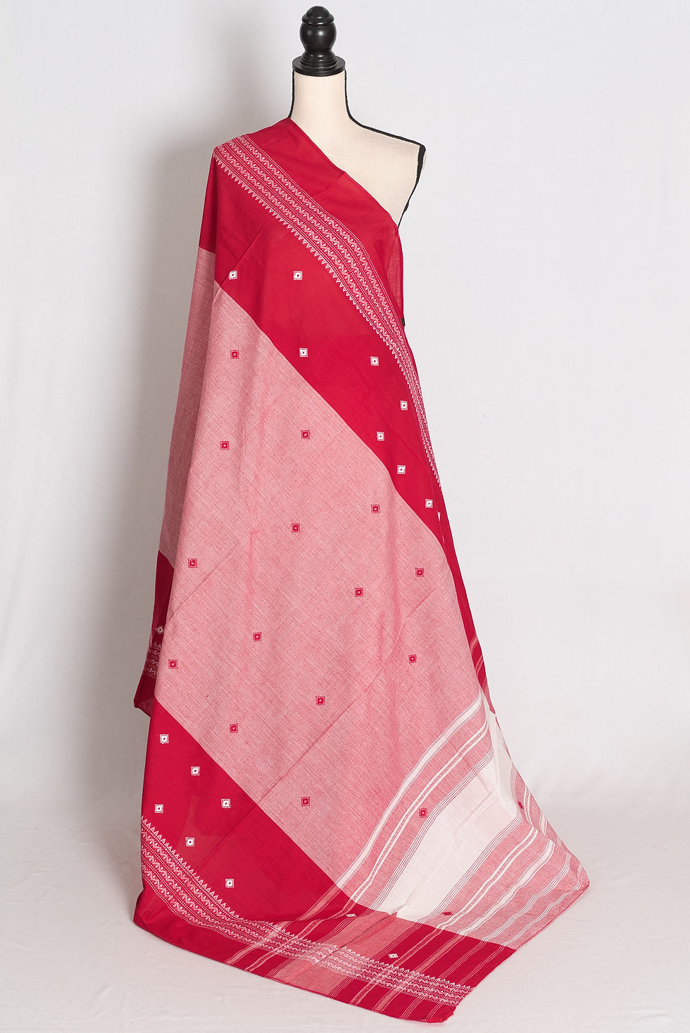 Red and Pink Dhaniakhali Soft Cotton Bengali Saree draped elegantly on a mannequin showcasing its traditional border.