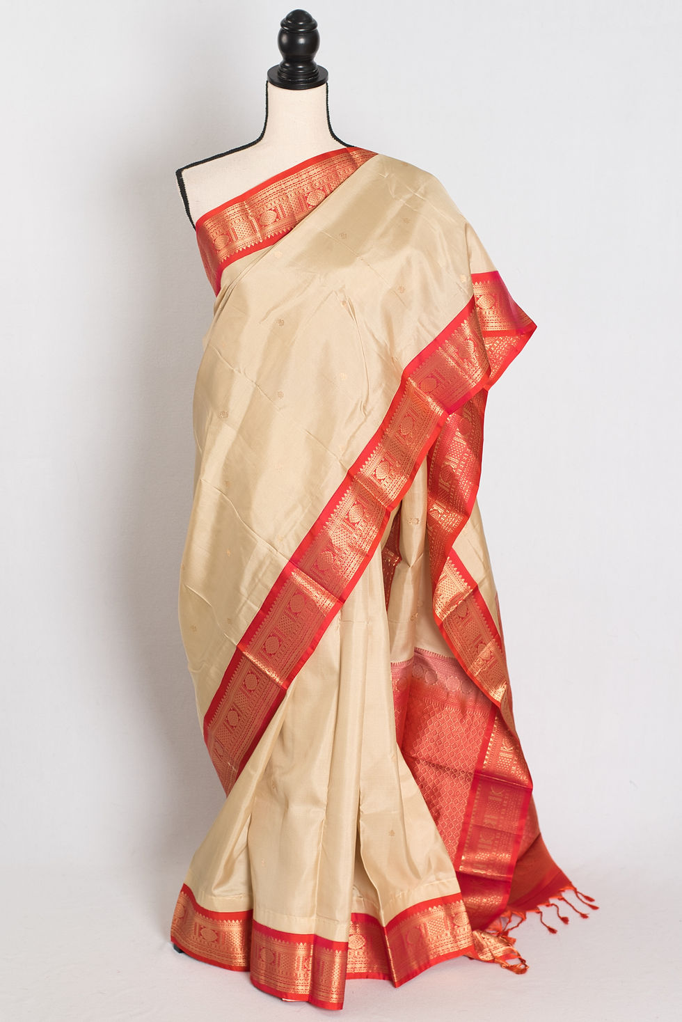 Clay white Kanjivaram silk saree with a coral pink gold zari border (Mohini Collection).