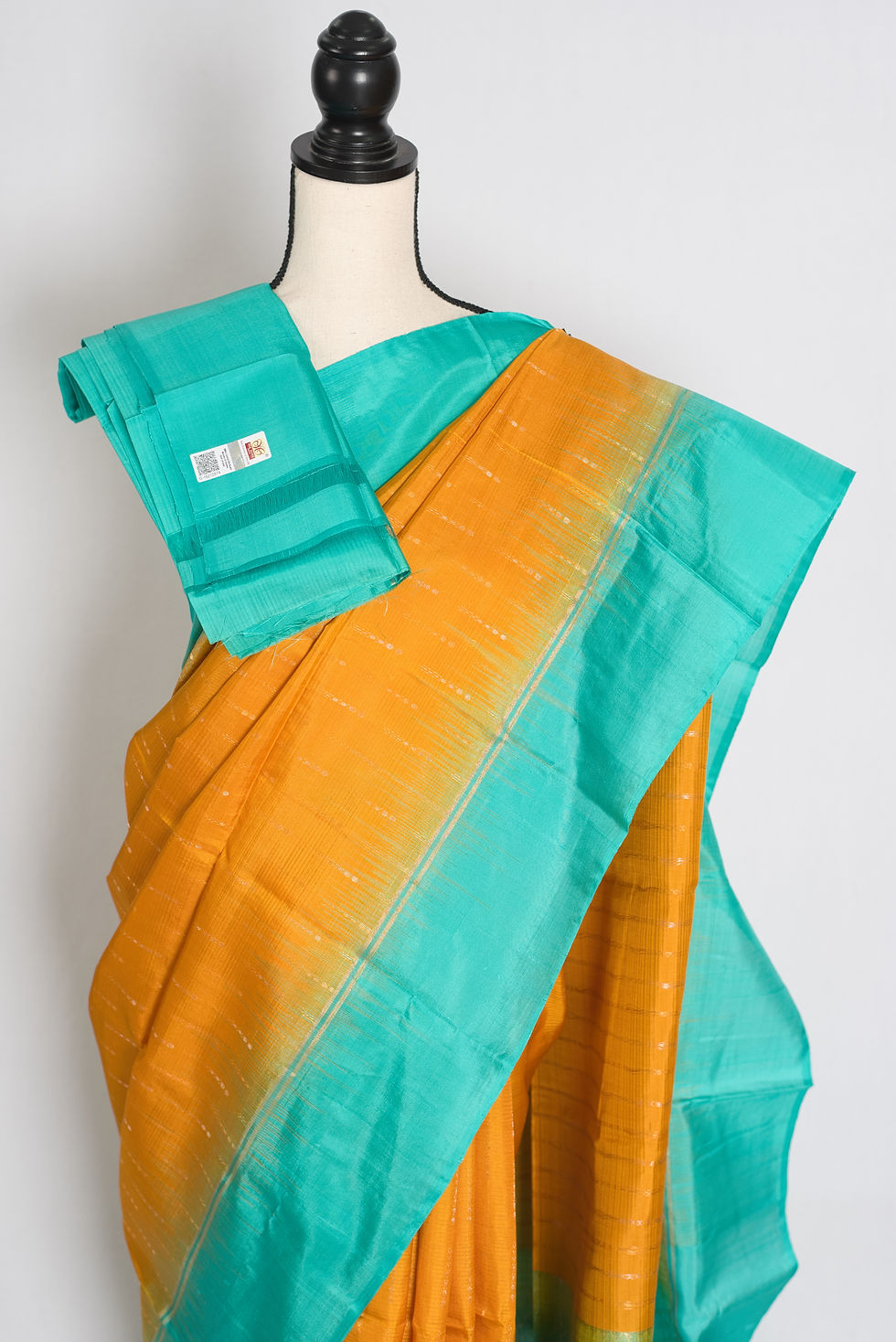 Thumbnail: Golden yellow lightweight Kanjivaram silk saree featuring fine zari dashes, a solid sea green border, sea green brocade pallu