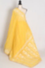 Full length front view of the Gita yellow and white blended cotton Jamdani saree with hand embroidery draped on a mannequin