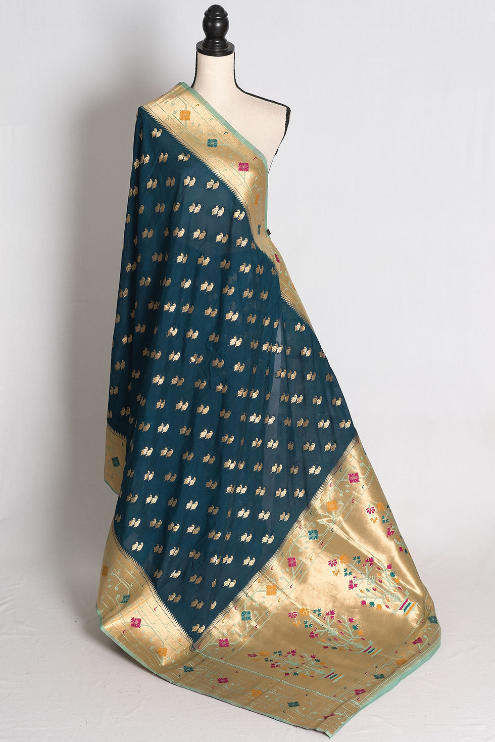 Blue Paithani Inspired Semi Silk Saree draped on a mannequin showcasing its light blue border and rich pallu.