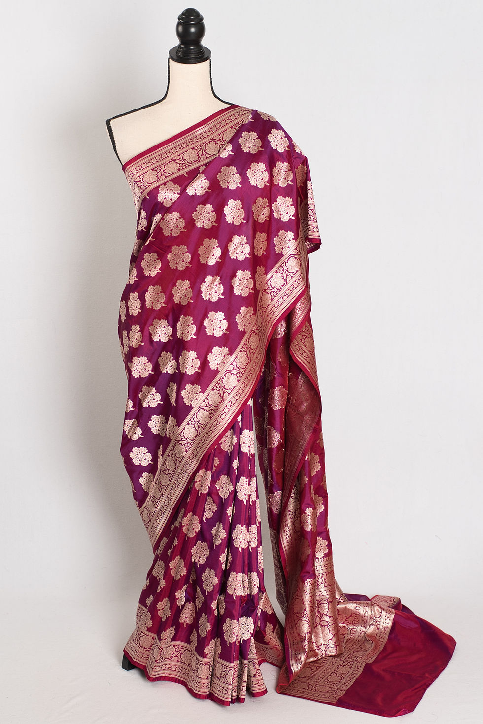 Deep burgundy bridal Banarasi silk saree with gold zari work (Ruma Collection).