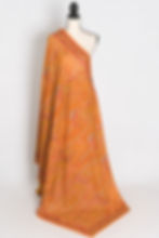 Full length front view of the Nirja orange georgette saree featuring dense all-over Kashmiri machine embroidery.
