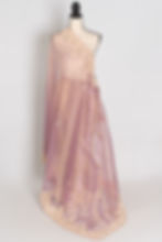 Front full-length view of the lavender soft tissue partywear saree draped on a mannequin.